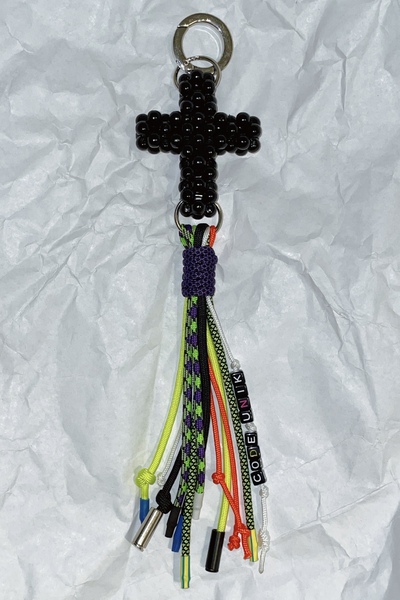 Black cross with bag tassel